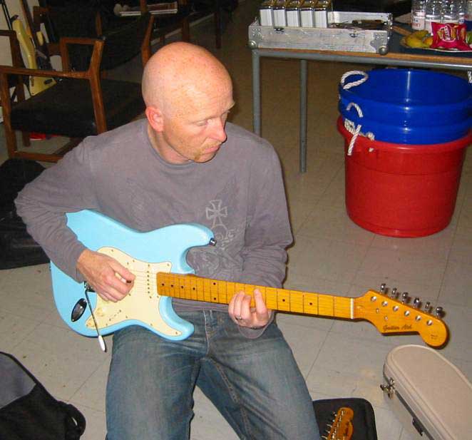 man playing lead guitar