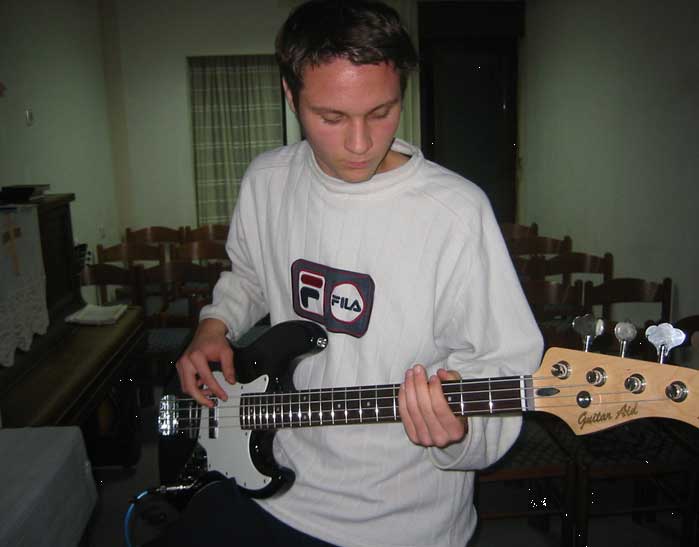 man playing black bass